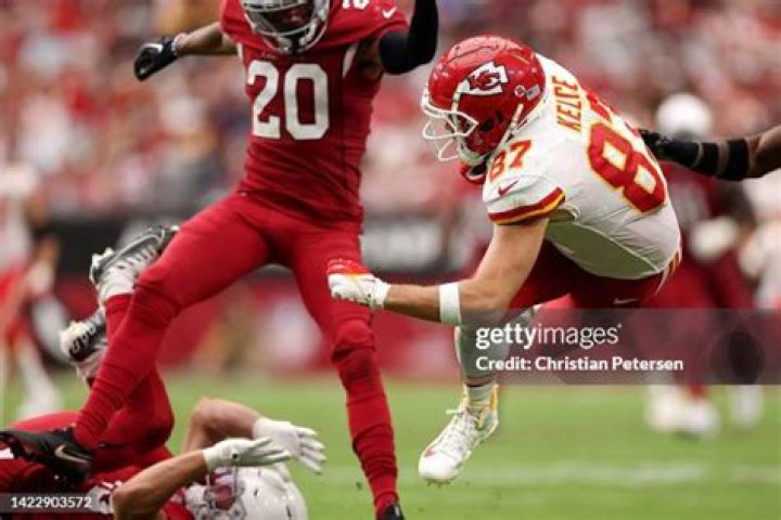 Kansas City Chiefs tight end Travis Kelce (87) kisses girlfriend Taylor Swift as he celebrates winning the game during Super Bowl LVIII between the...